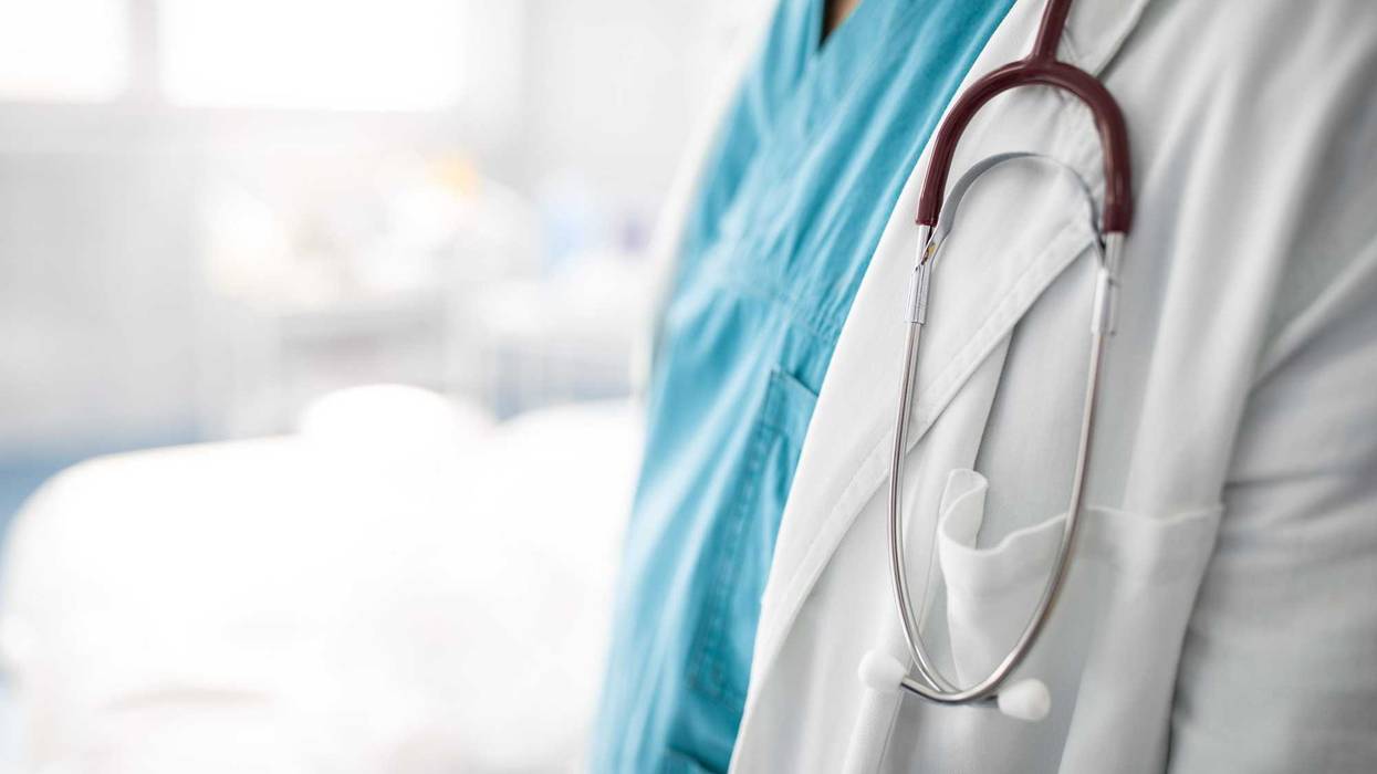 Close up photo of stethoscope around the neck of unrecognizable doctor