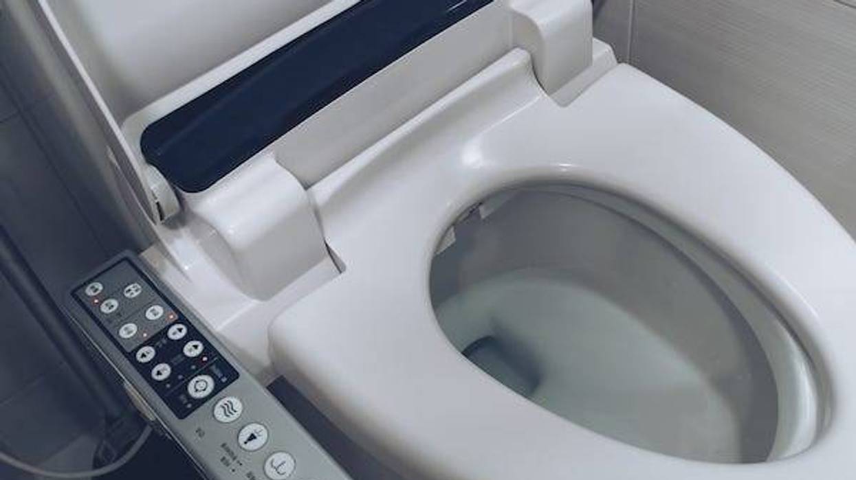Close up view of smart toilet seating with washing, cleaning, drying functions
