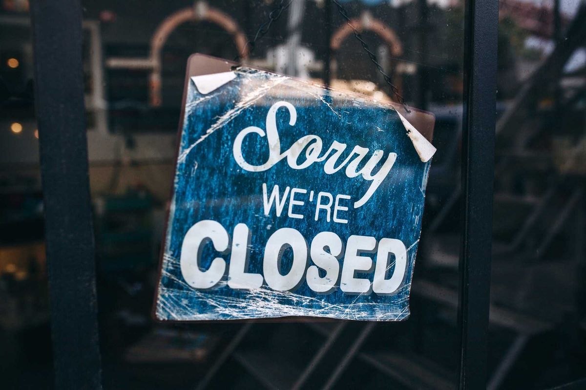 Closed sign in store window.