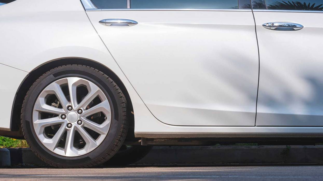 Closeup of a back car tire.