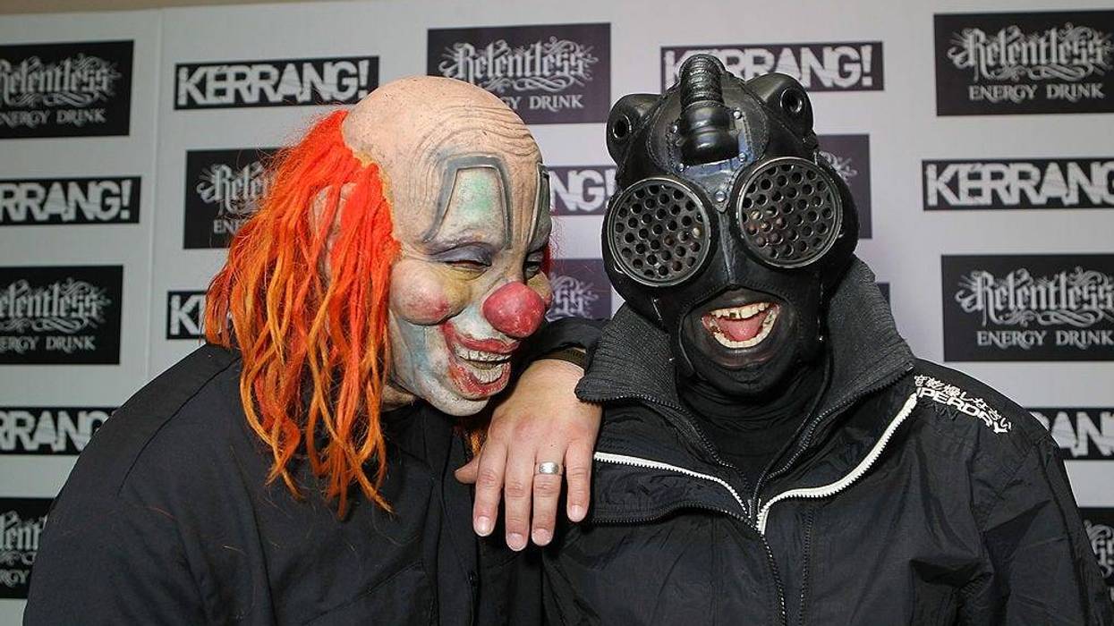 Clown and Sid of Slipknot pose in the winners room at The Kerrang! Awards at the Troxy on June 13, 2013 in London, England