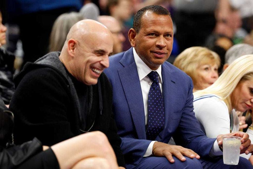 Co-owners Alex Rodriguez (R) and Marc Lore of the Minnesota Timberwolves look on in the second quarter during the game against the Los Angeles Lakers at Target Center on December 30, 2023 in Minneapolis, Minnesota.