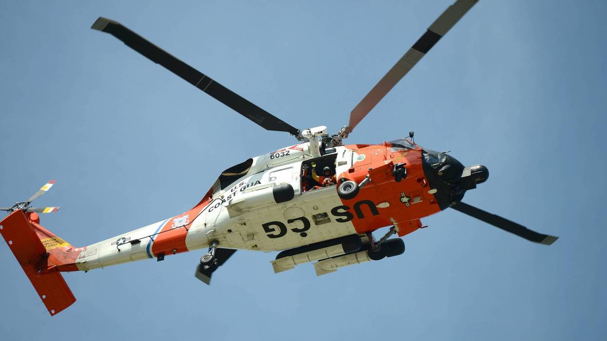 Coast Guard members in the air and on the water worked save three people in the Detroit River last night after a boater's vessel caught fire.