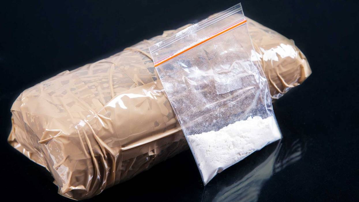 Cocaine powder in plastic bag with a packages