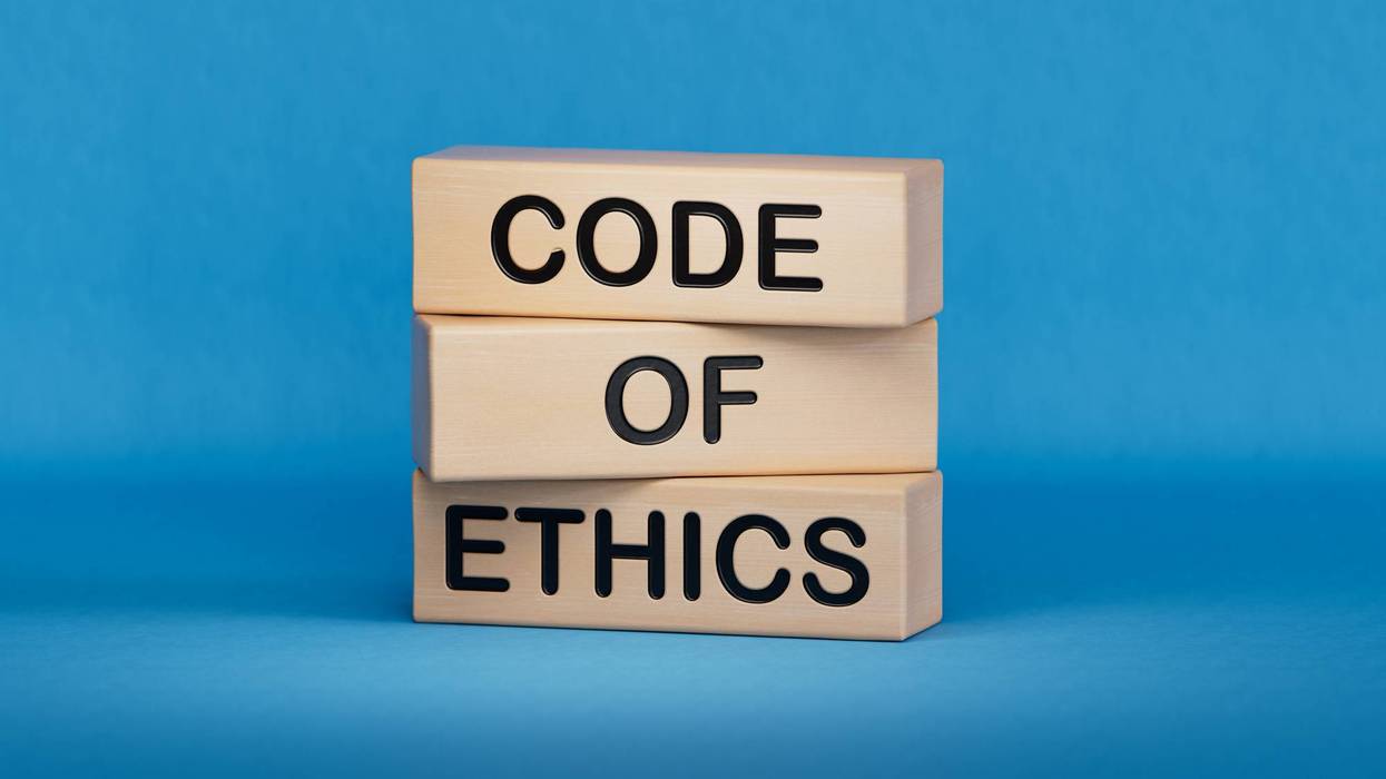 Code of ethics symbol. Concept words Code of ethics on wooden blocks.Business and Code of ethics concept. Copy space.3D rendering on blue background.