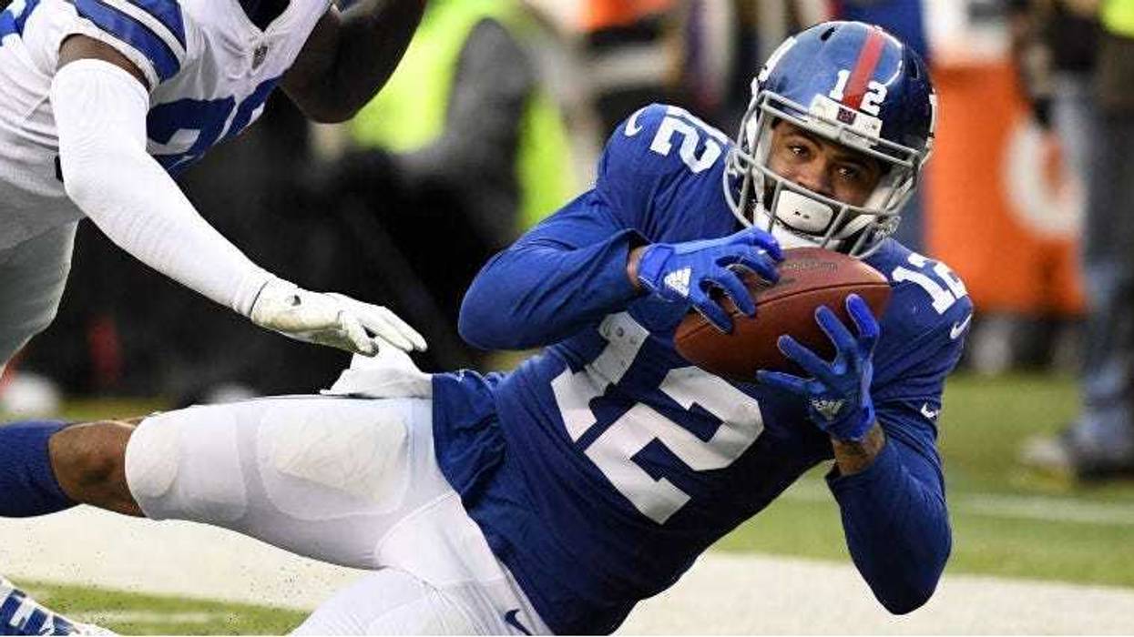 Cody Latimer catches the ball against Anthony Brown in the fourth quarter at MetLife Stadium.