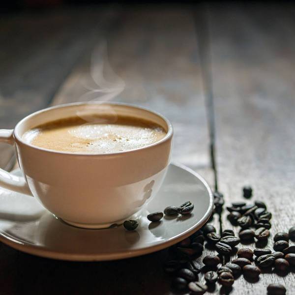 Coffee cup and coffee beans on wooden table, Espresso Crema coffee cup aromatic