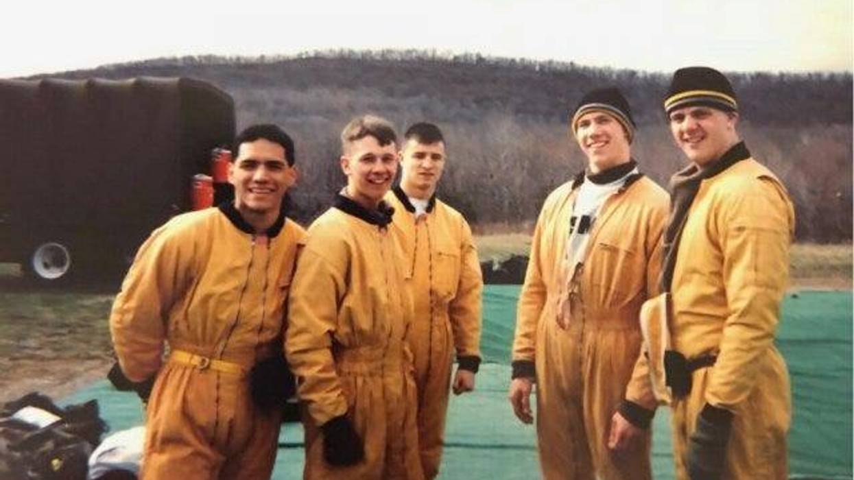 Col. Drew Morgan, center, a member of USMA Class of 1998, is pictured during his time as a member of the West Point Parachute Team