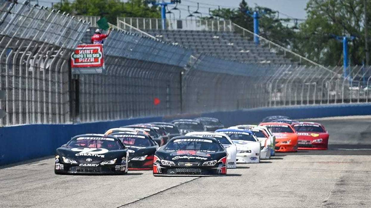 Cole Butcher (28), left, and Casey Roderick (26) lead the field to the green flag for the ASA STARS National Tour Father’s Day 100 on Sunday, June 16, 2024, at the Milwaukee Mile in the West Allis, Wisconsin.