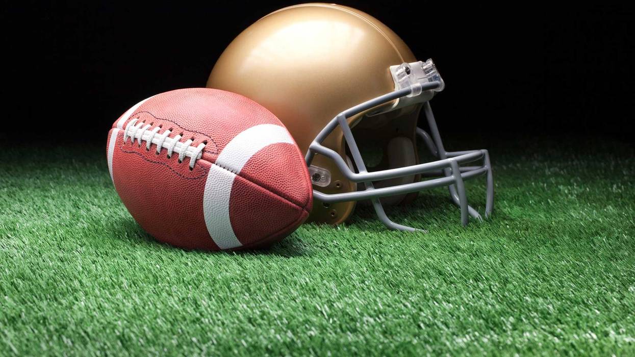 College style football and helmet.