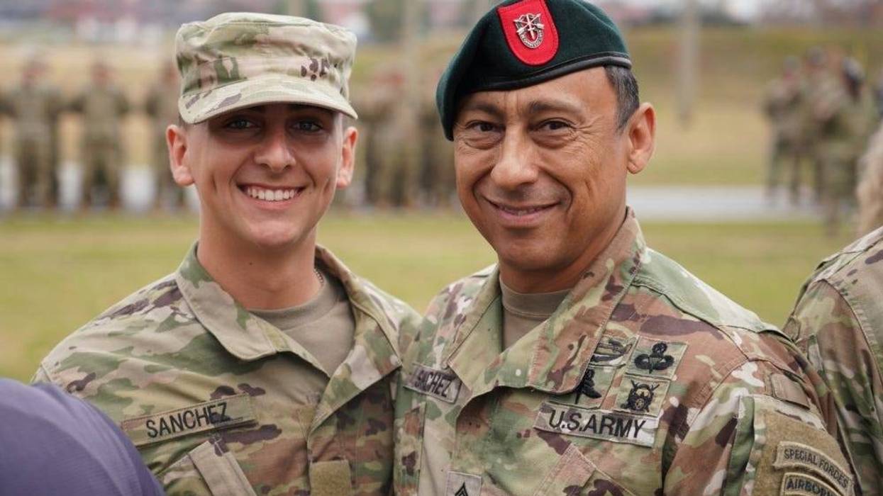 Command Sgt. Maj. Terry M. Sanchez (right), command sergeant major of the 7th Special Forces Group (Airborne), and Pvt. Diego Sanchez (left) pause for a photo during the graduation ceremony at the U.S. Army Airborne School