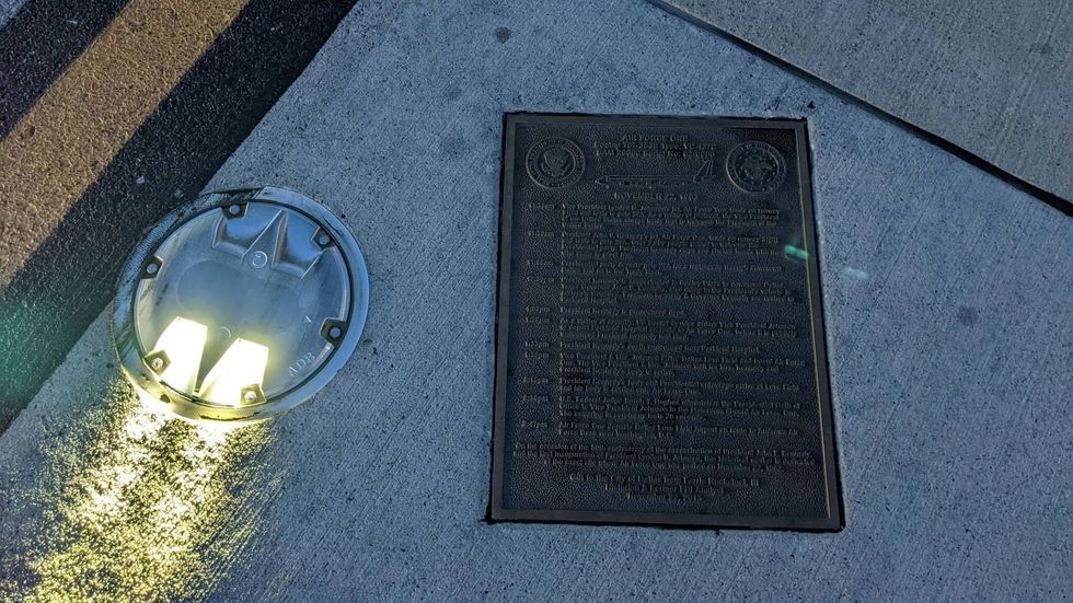 Commemorative plaque embedded in tarmac at Dallas Love Field