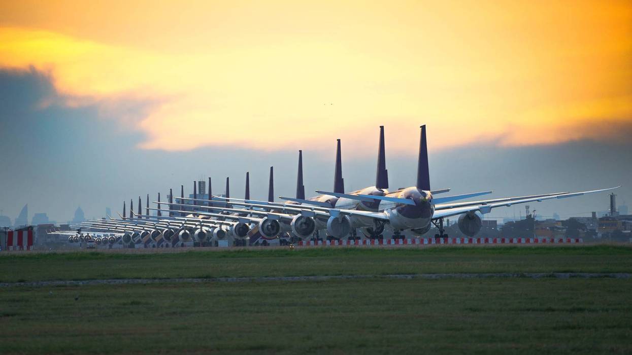 Commercial airplane parking at an airport.