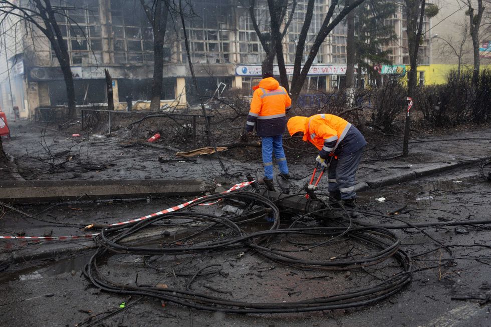 Communal workers fix the electric wires on March 2, 2022 in Kyiv, Ukraine
