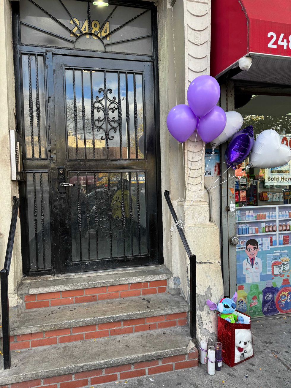 Community mourners on Monday put balloons, candles and gifts outside the apartment where 4-year-old Jahmeik Modlin was found dead on Sunday.