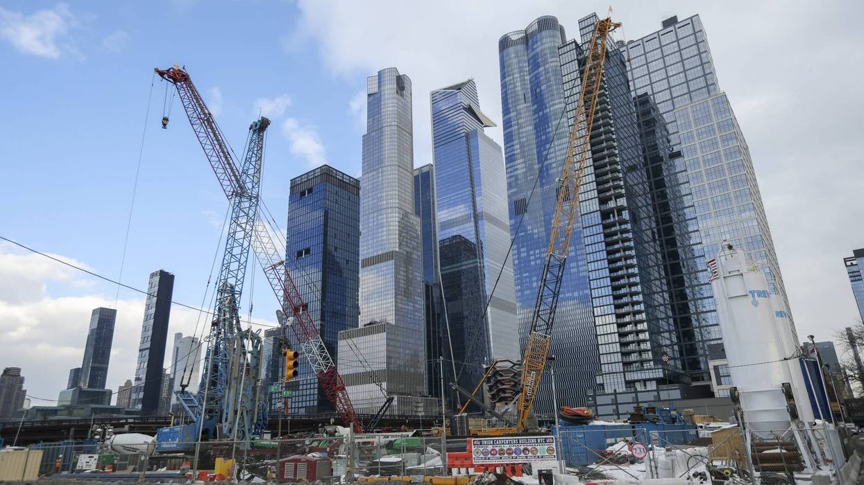 Commuters board a New Jersey Transit train at Penn Station in New York.