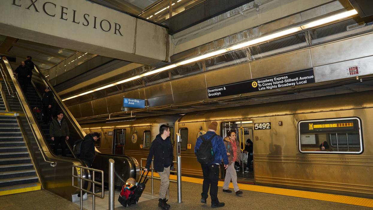 Commuters board a southbound Q train at the 96th Street-Second Avenue subway station in New York.