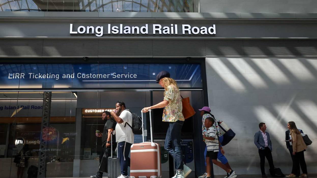 Commuters near Long Island Rail Road signage at Moynihan Train Hall in New York on Sept. 15, 2025