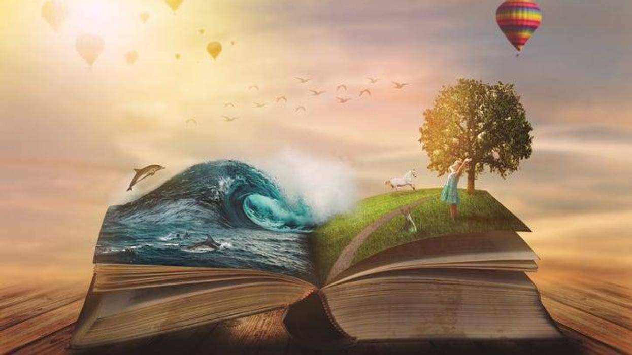 Concept of an open magic book; open pages with water and land and small child
