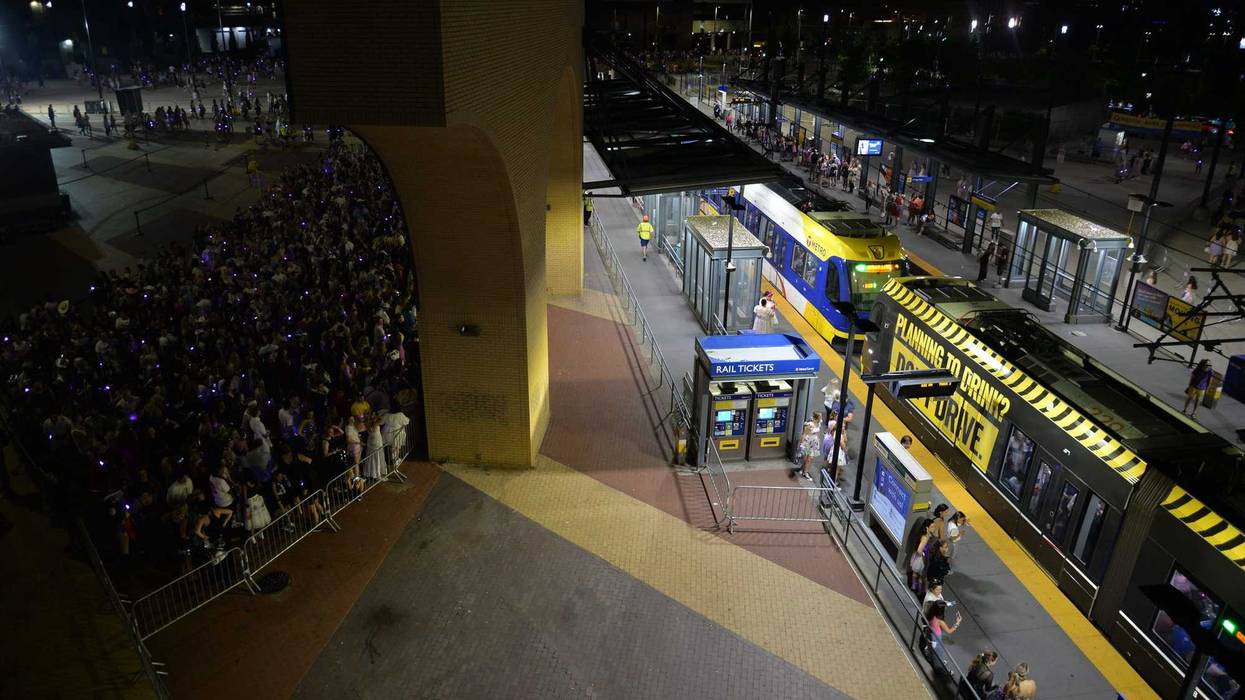 Concertgoers waiting for trains outside U.S. Bank Stadium.