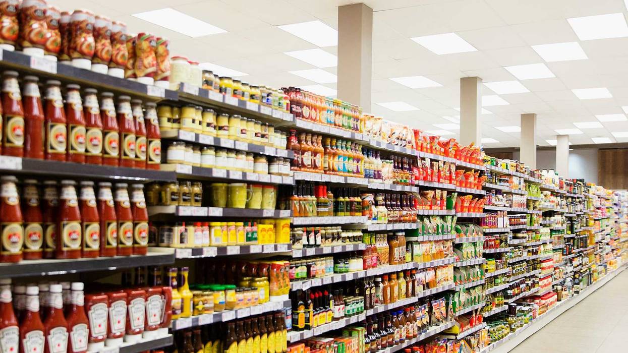 Condiments on a grocery store shelf.
