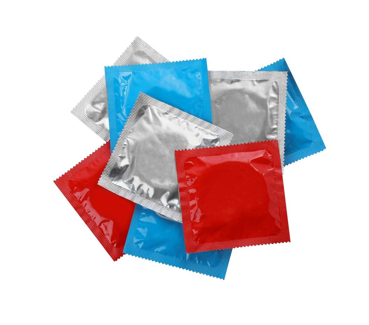 Condom packages isolated on white, top view. Safe sex
