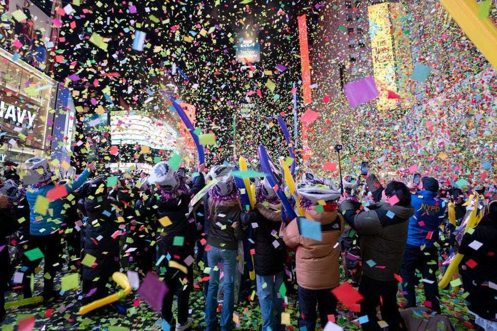 Confetti falls on revelers during New Year