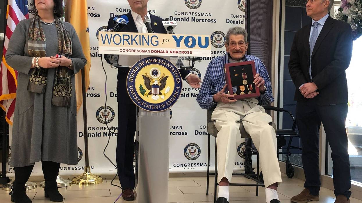Congressman Donald Norcross presents World War II veteran Gilbert Klein with medals at a ceremony in Haddon Township, New Jersey, on Dec. 3, 2024.