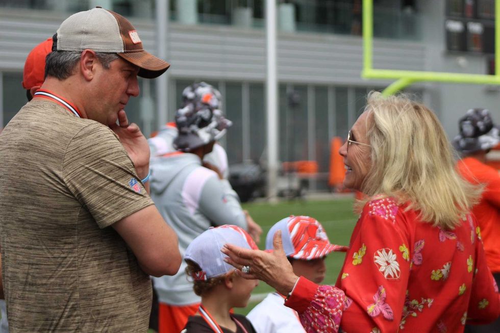 Congressman Tim Ryan speaks with Dee Haslam during training camp practice on August 1, 2022 in Berea, Ohio.