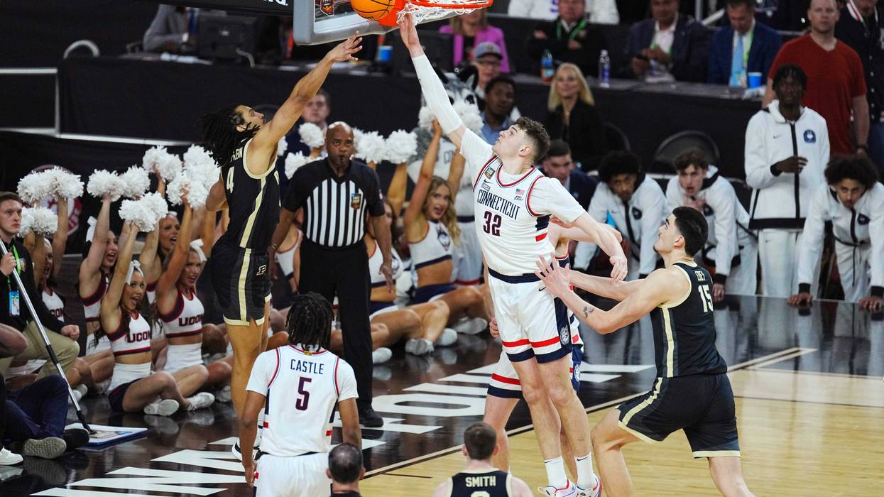 Connecticut Huskies center Donovan Clingan (32) blocks Purdue Boilermakers forward Trey Kaufman-Renn (4) in the first half in the national championship game of the Final Four of the 2024 NCAA Tournament at State Farm Stadium in Glendale on April 8, 2024.