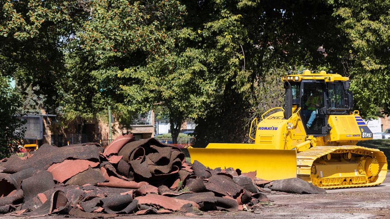 Construction crews tear up the turf field and track in Jackson Park starting construction on The Barack Obama Presidential Center in Chicago on Monday, Aug. 16, 2021.