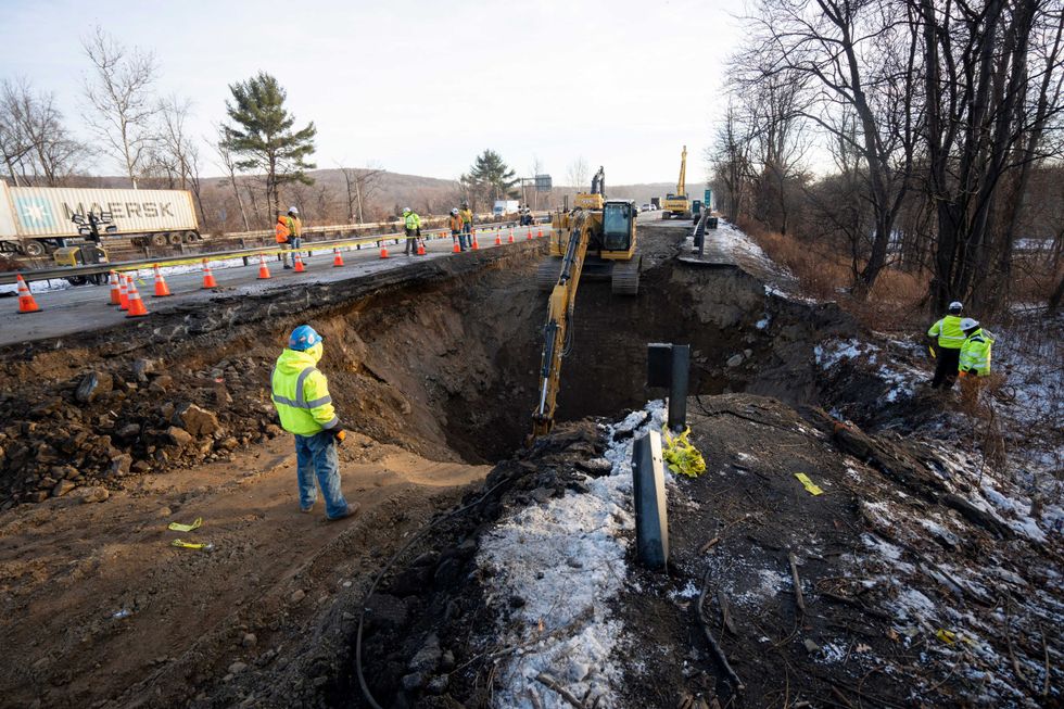 Construction workers continue repairs using heavy machinery on I-80 East in Wharton on Friday, Dec. 27, 2024
