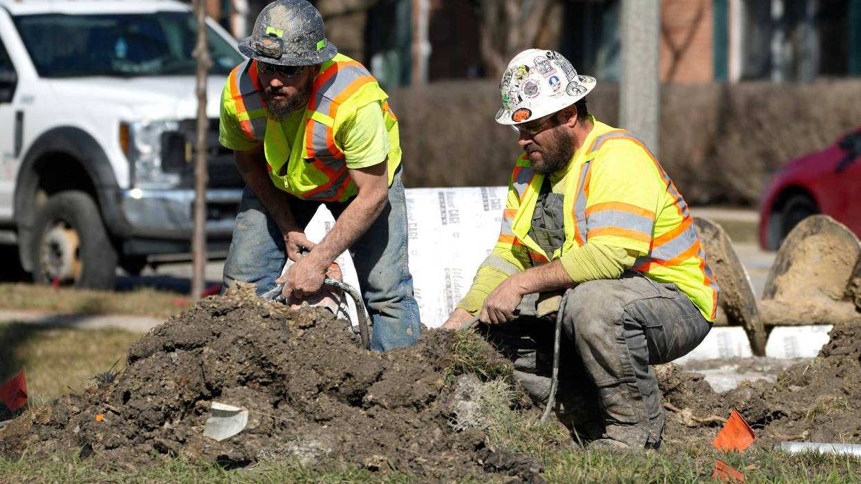Construction workers work