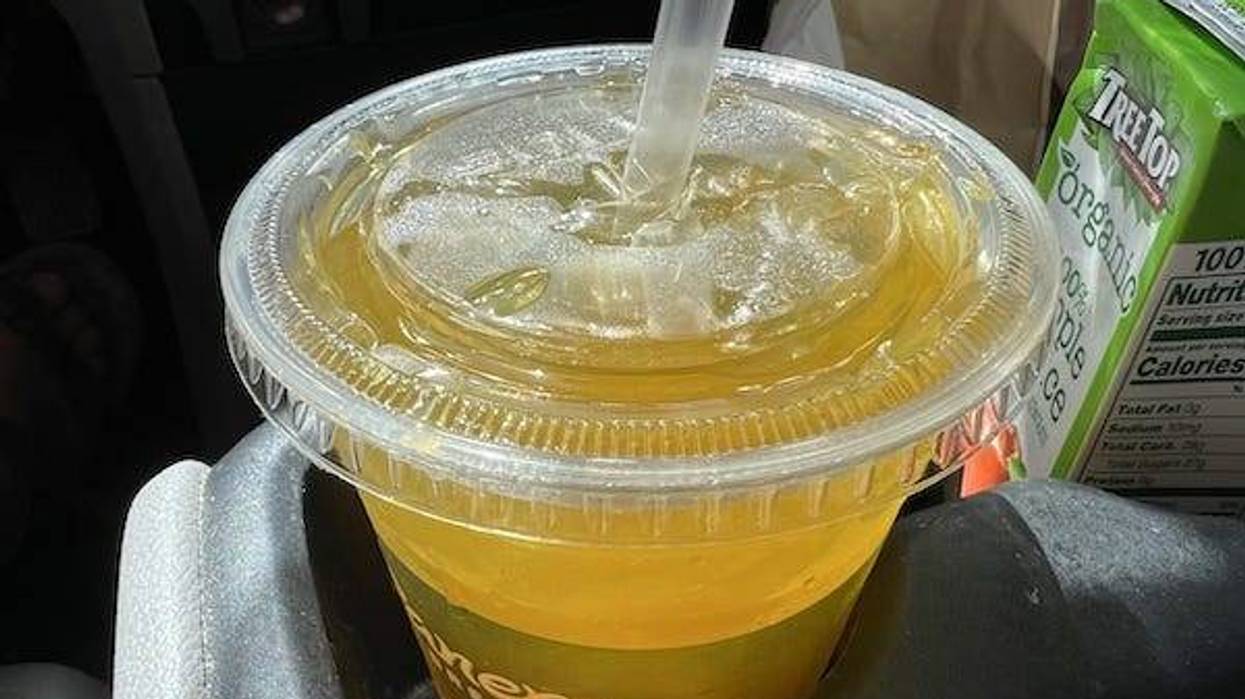 Container of Panera Charged Lemonade in a to-go carrier