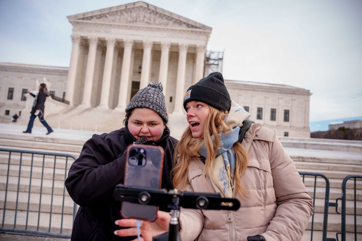 Content creators Callie Goodwin of Columbia, S.C., (L) and Sarah Baus of Charleston, S.C., (R) speak to a live stream audience outside the U.S. Supreme Court Building after the court heard oral arguments on whether to overturn or delay a law that could lead to a ban of TikTok in the U.S., on January 10, 2025 in Washington, DC.