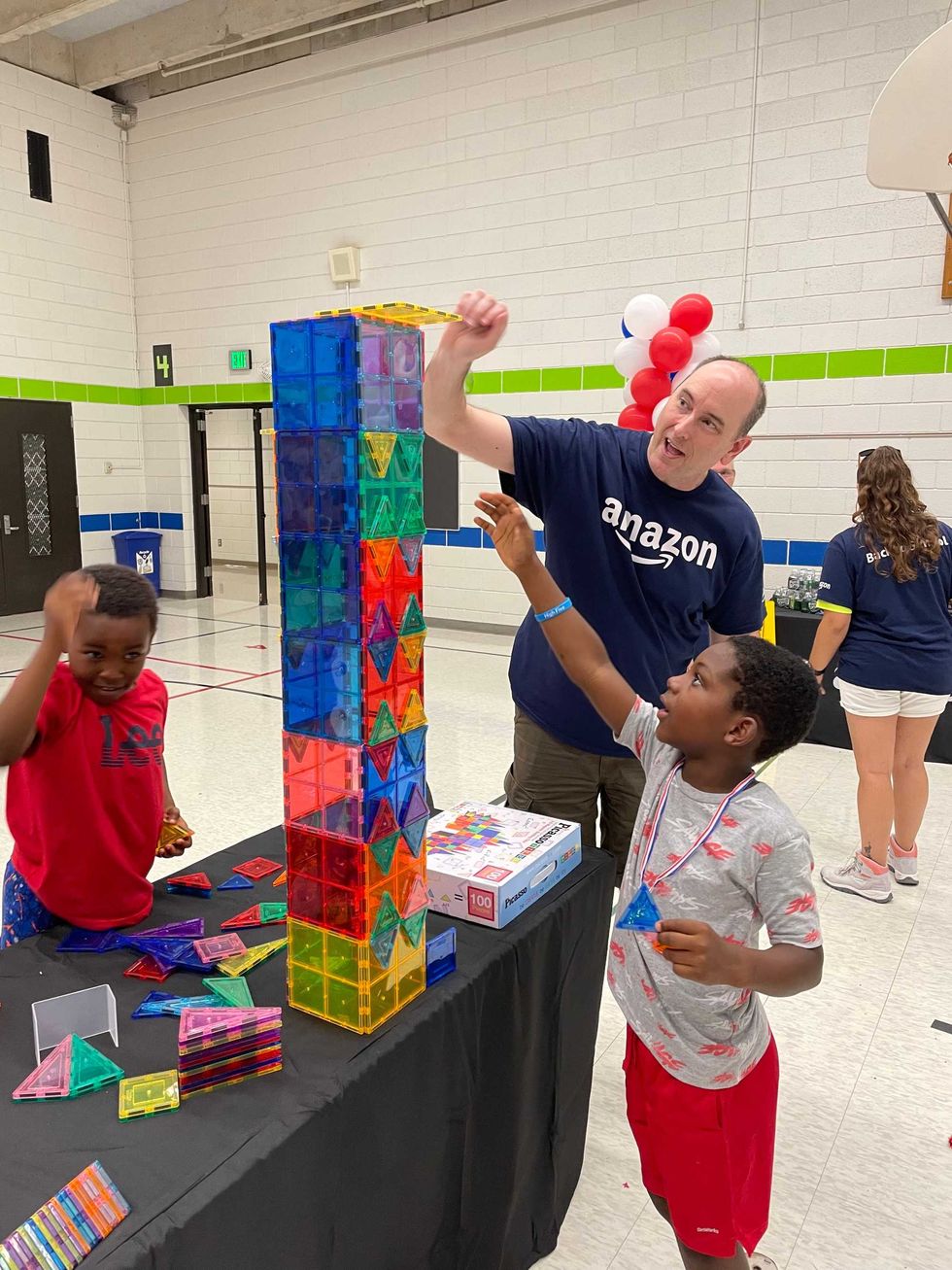 Cordell Brown builds with an Amazon worker