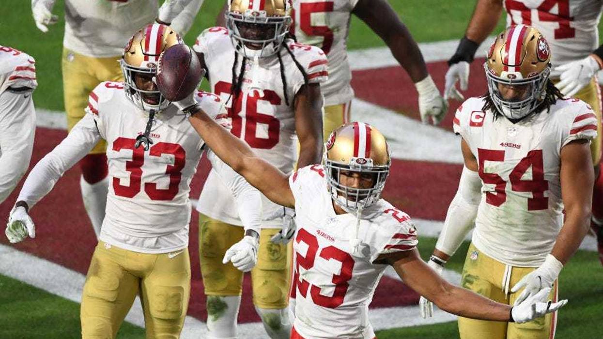 Cornerback Ahkello Witherspoon #23 of the San Francisco 49ers celebrates with teammates after intercepting the ball