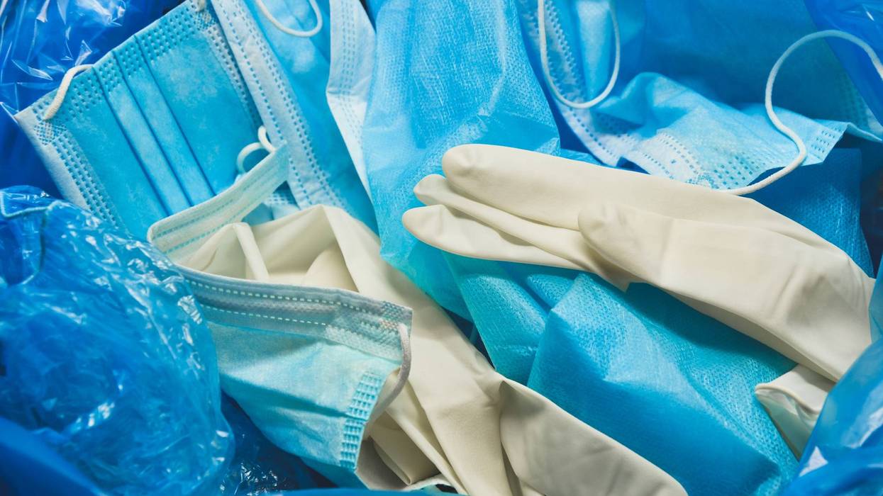 Coronavirus protection equipment in medical waste bin