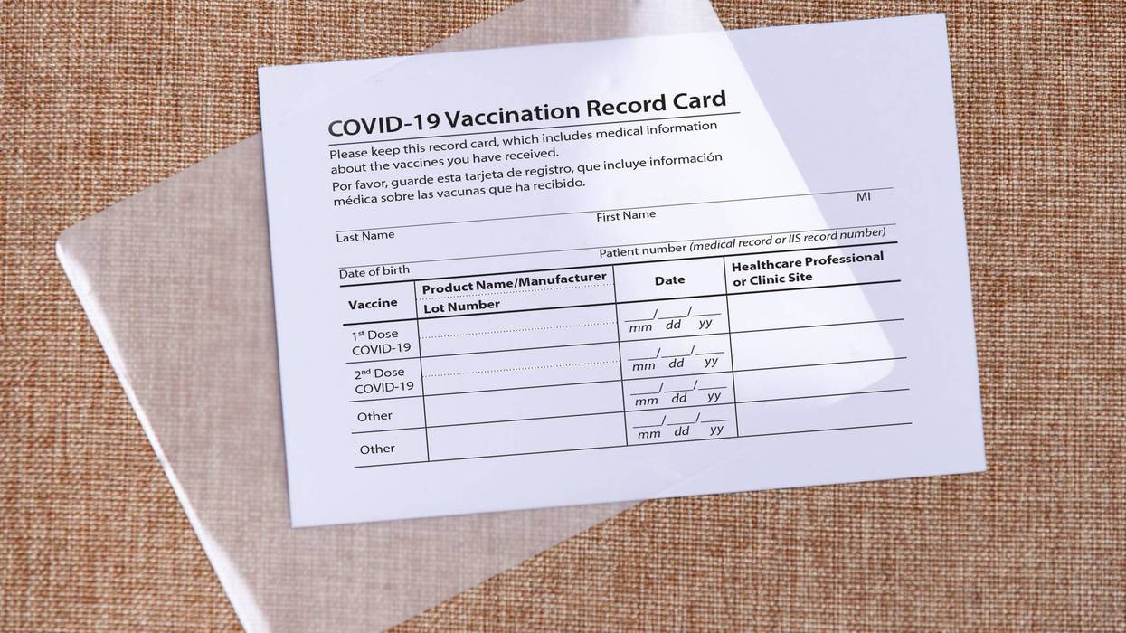 Coronavirus vaccination card and laminate foil. Concept of safe traveling and overcoming of coronavirus. High quality photo