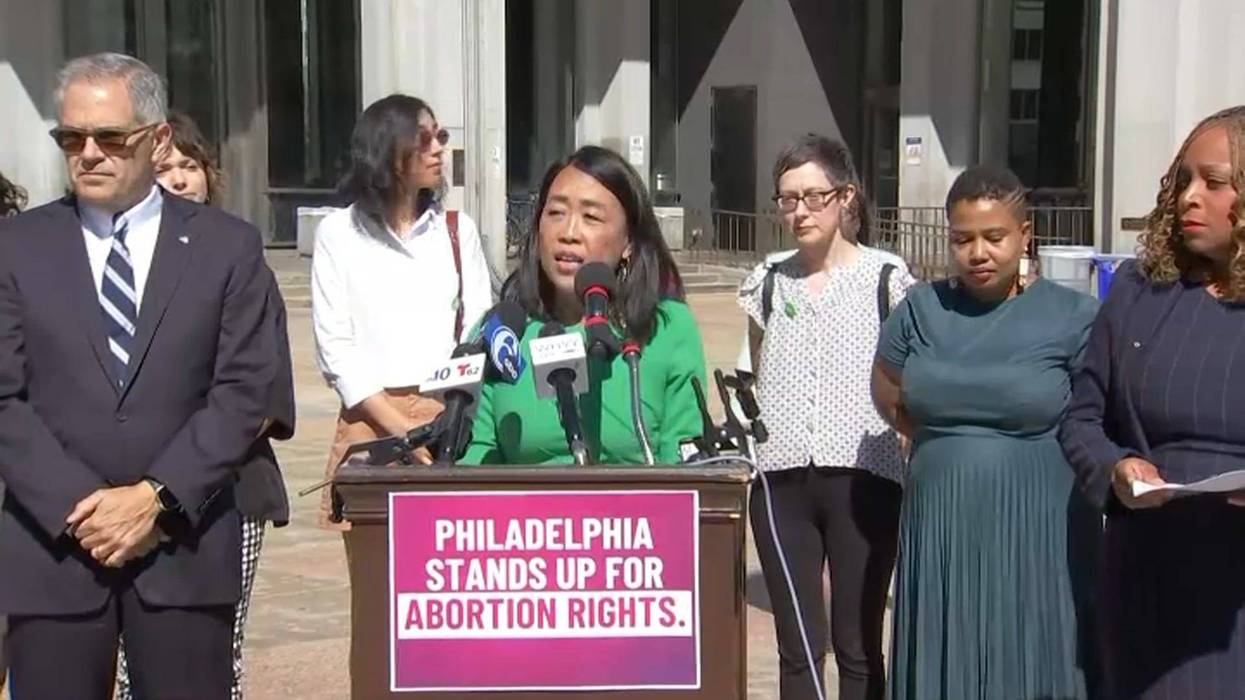 Councilmember Helen Gym (podium), along with councilmembers Kendra Brooks and Jamie Gauthier, introducing legislation to protect particular abortion rights in Philadelphia.