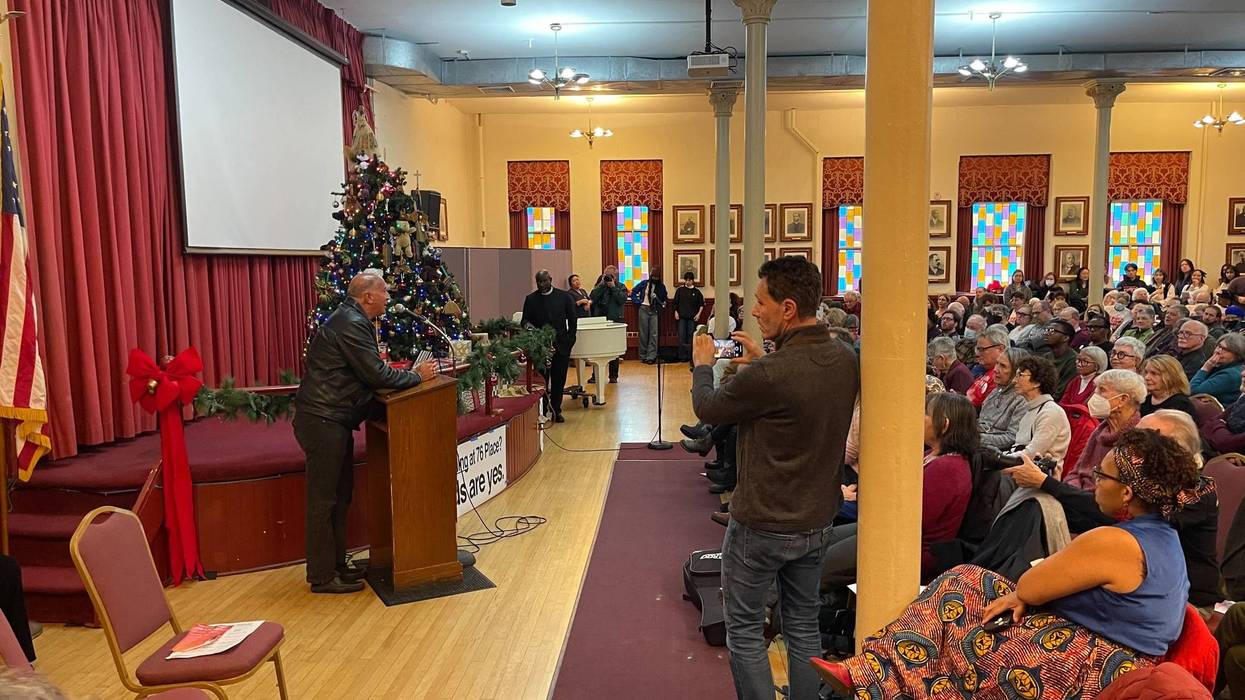 Councilmember Mark Squilla (at podium) discusses the proposed 76ers arena at a community meeting on Dec. 17, 2023.