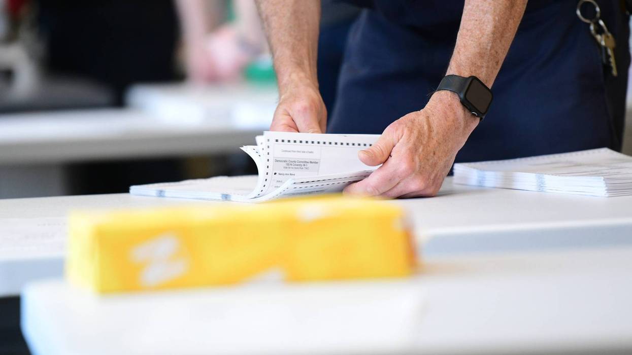 County officials perform a ballot recount on June 2, 2022, in West Chester, Pennsylvania.