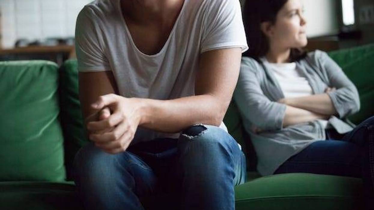 Couple arguing sitting on the couch