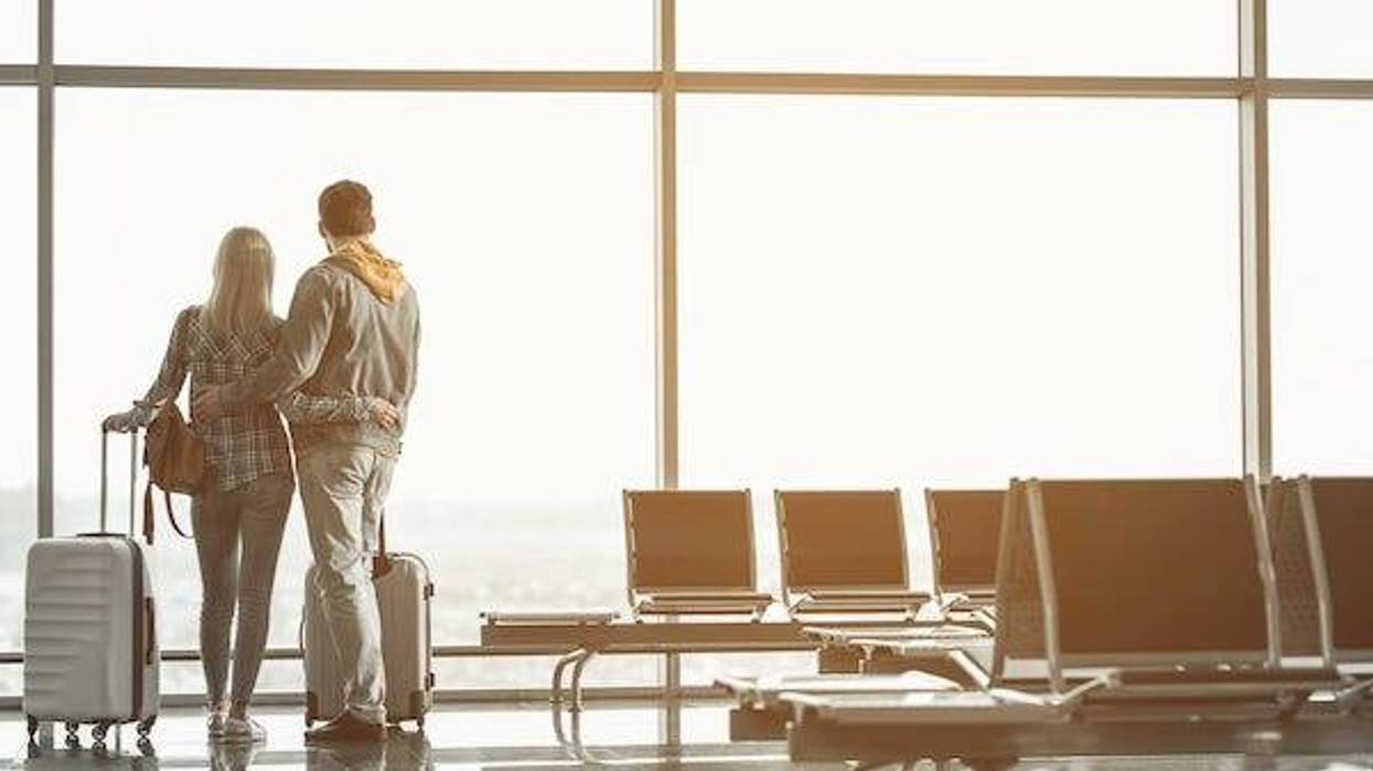 Couple embracing each other at the airport