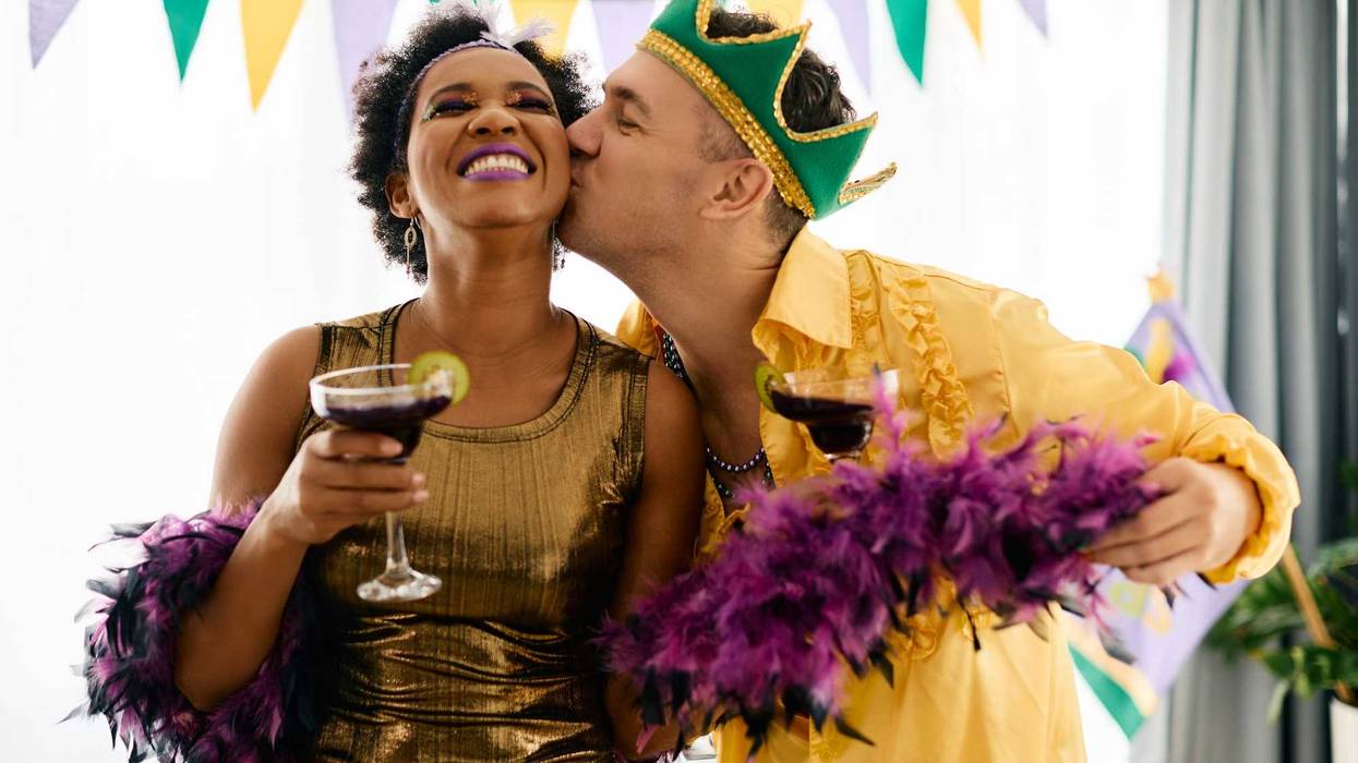 Couple kissing on Mardi Gras.