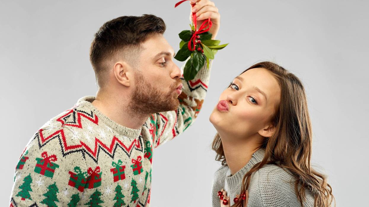 Couple kissing under mistletoe