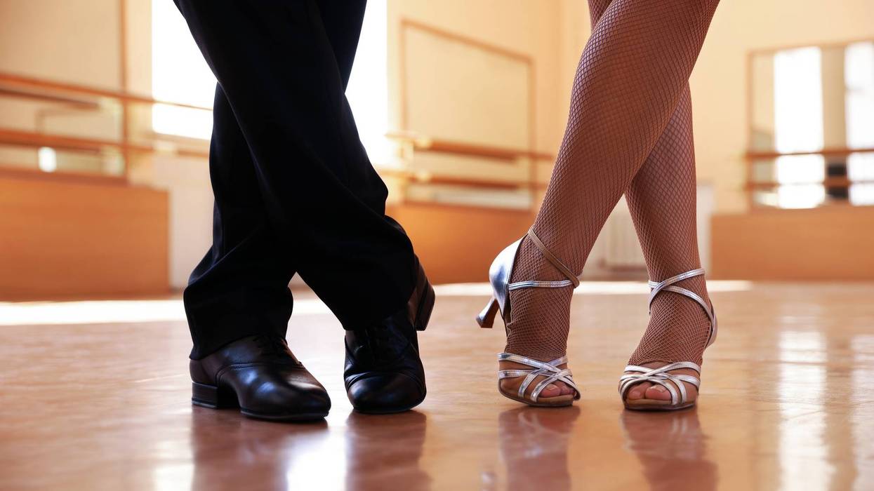 Couple of professional dancers training in studio, closeup