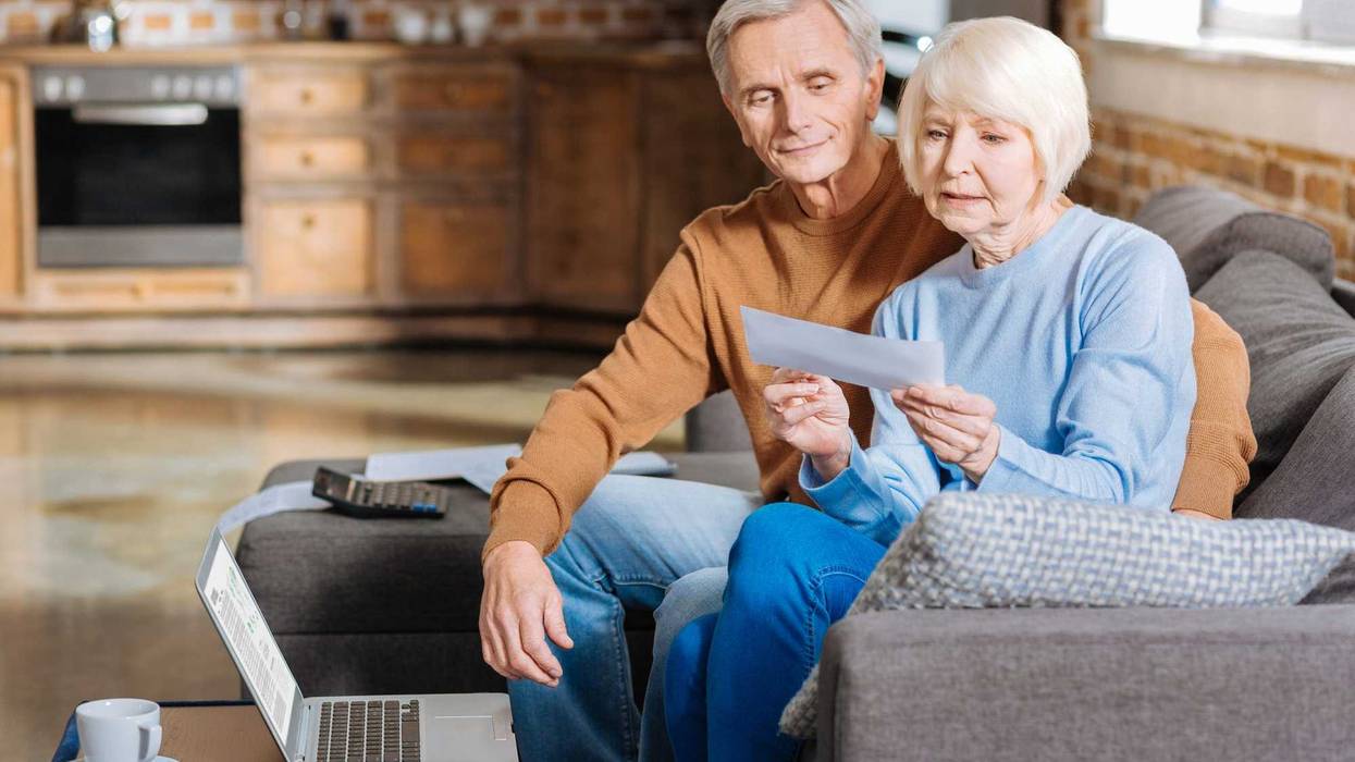 Couple researches social security stock photo.