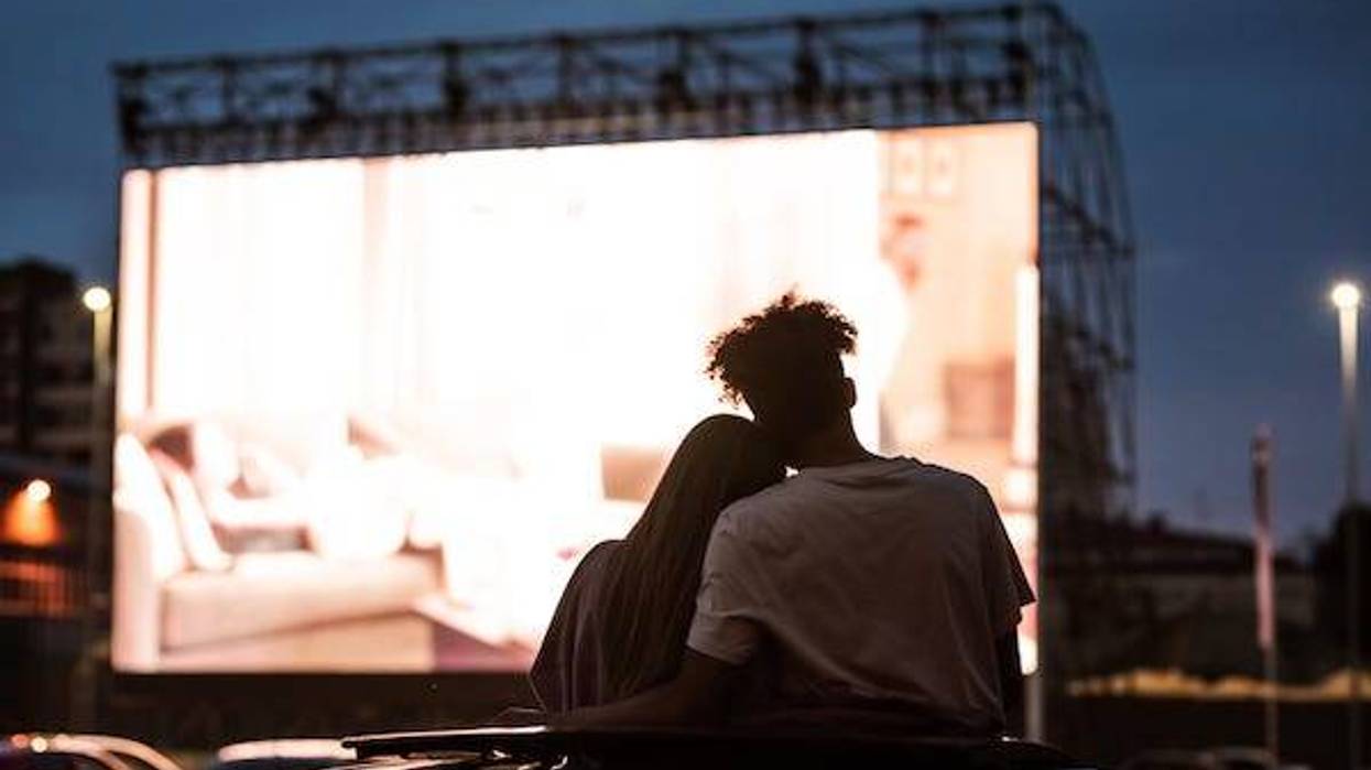 Couple watching movie at Drive-In theater