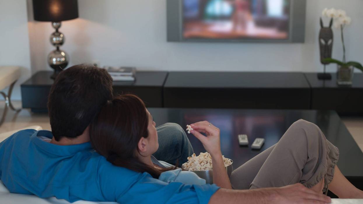 Couple watching movie on couch